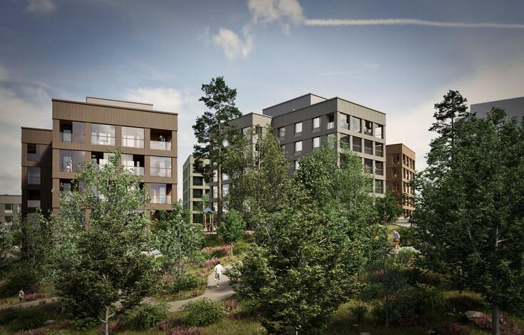 Näkymä puistosta harmaansävyiseen kerrostaloon.