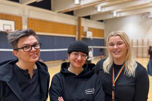 Hannes Särkkä, Ävin Bapiiri and Hanna Malmivaara in the sports hall of Helsinki Upper Secondary School of Media Arts.