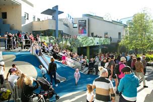 People spending time at the Kantsu Village Festival in front of Kanneltalo.