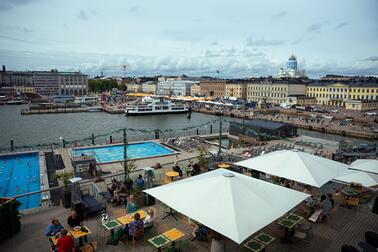 View of the Market Square with terrace, swimming pools and boats.