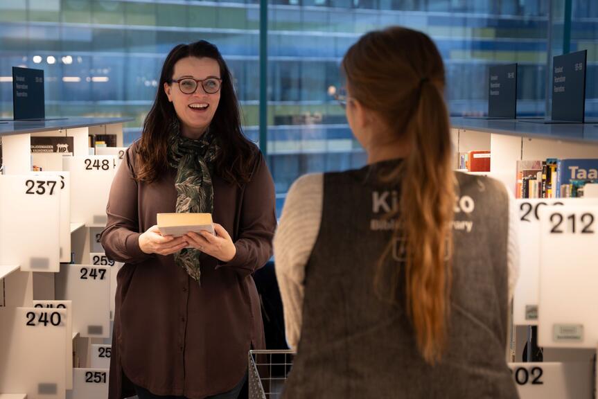 An encounter between two women at Central Library Oodi in Helsinki.