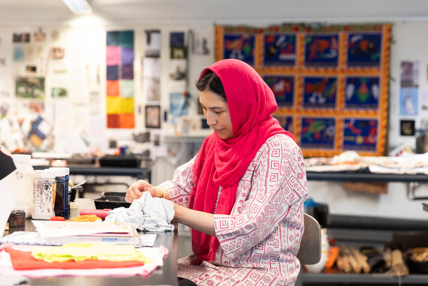 A woman is doing handicrafts.