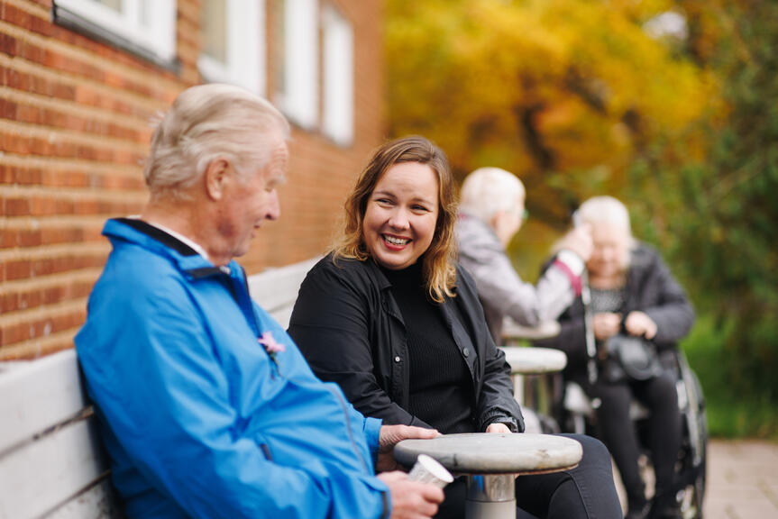 People sitting and having a conversation.