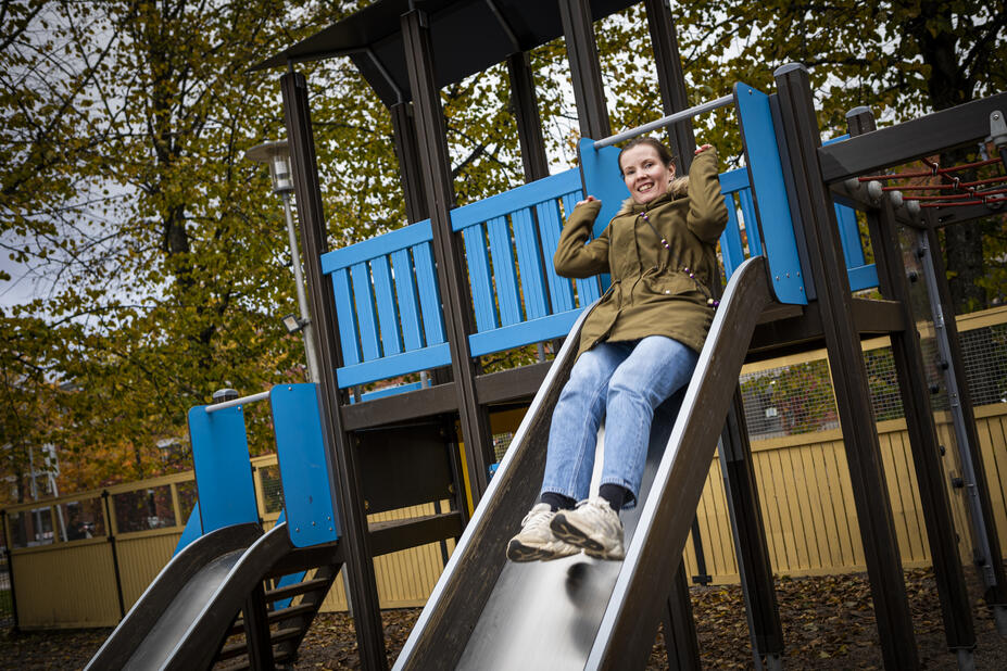 Teacher Siru Varsamäki in children's slide