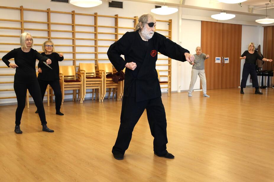 Karate class participants practicing the correct technique.