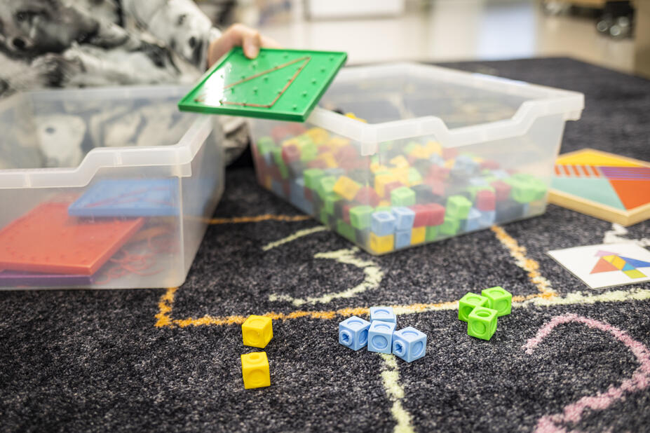 Children's games in two plastic boxes