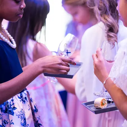 Children in festive attire eating.