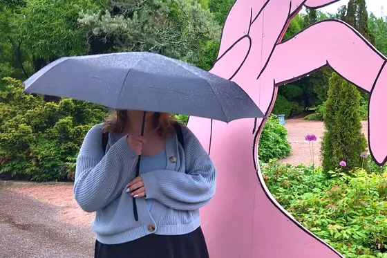 Noora under an unbrella.