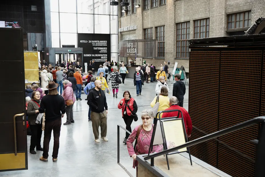 People walking in the lobby of Cable Factory.