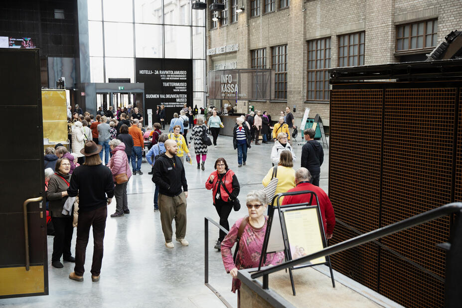 People walking in the lobby of Cable Factory.
