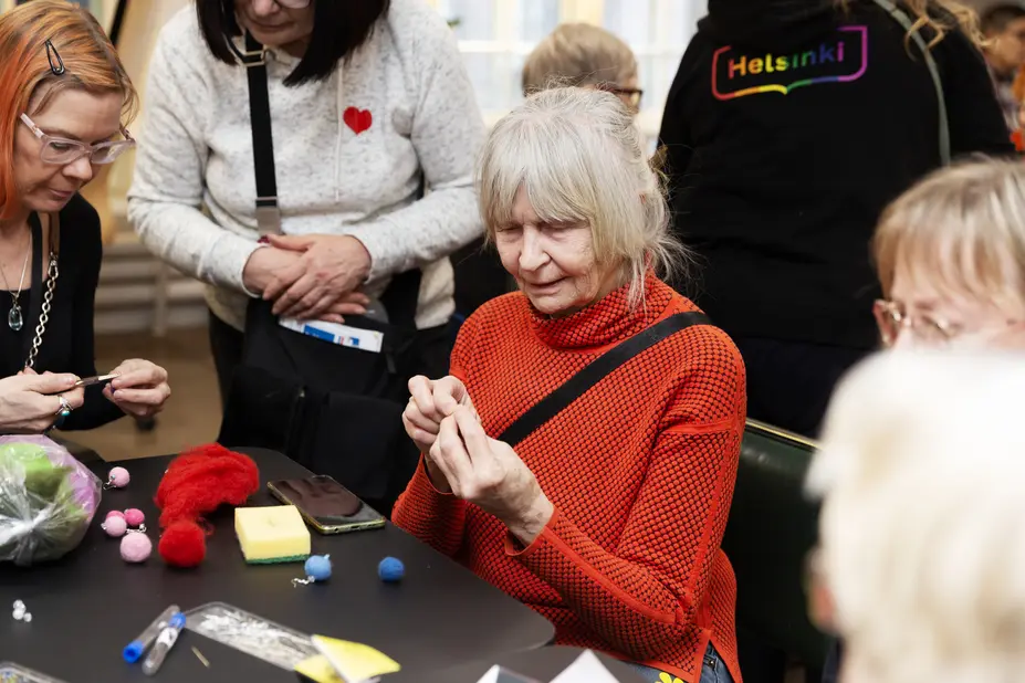 Pensioners doing handicrafts.