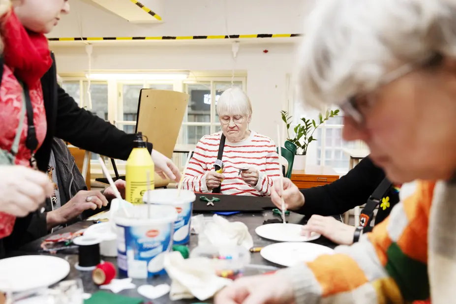 Pensioners doing handicrafts.