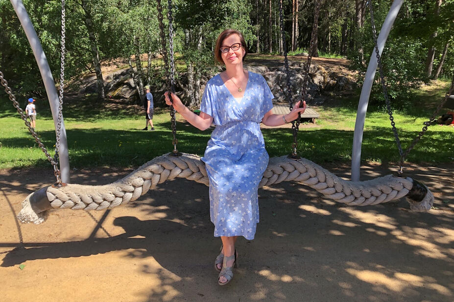 Minna Hoffström, CEO of the municipal enterprise Palvelukeskus Helsinki is sitting in the playground.
