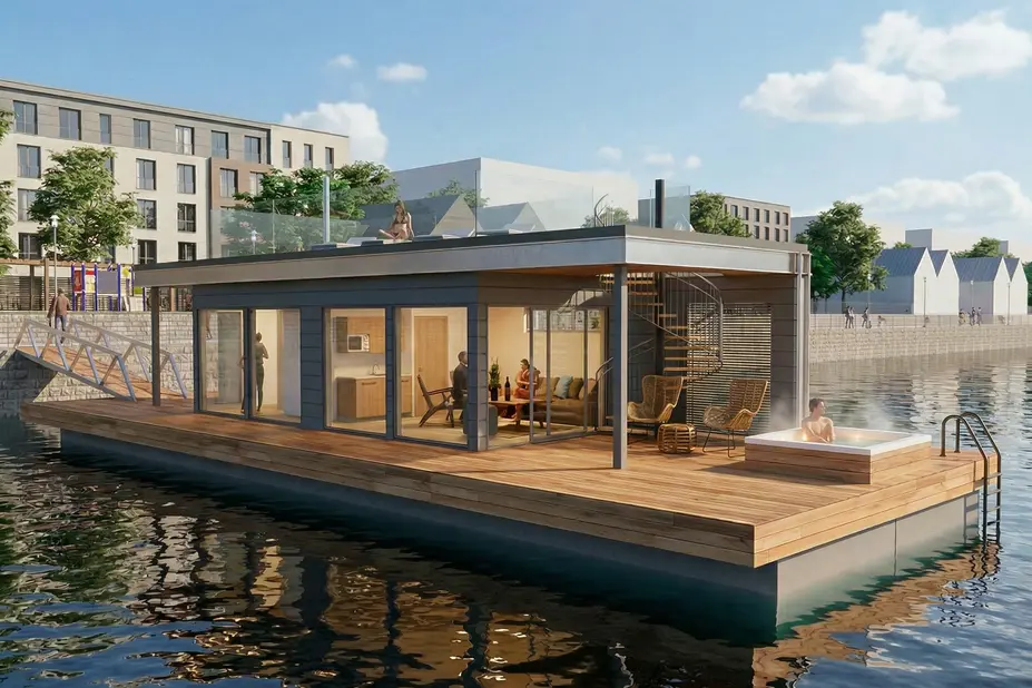 Kelluva showroom-asunto päivävalossa Verkkosaaressa; moderni rakennus veden päällä, terassi ja näkymä merelle.