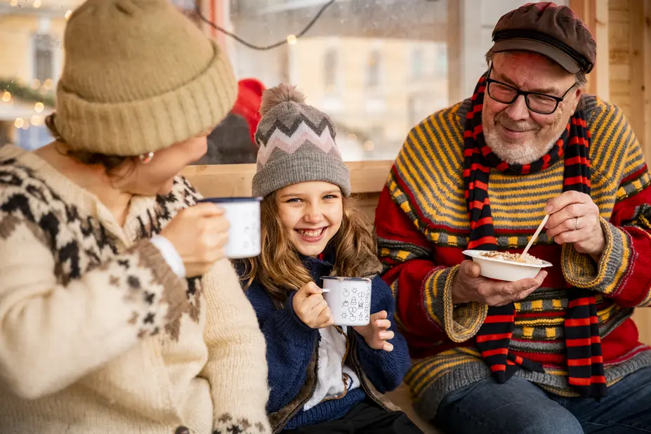 A family enjoying Christmas treats.