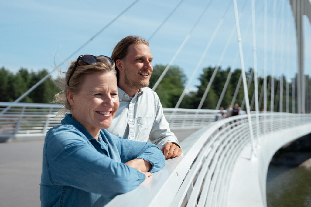 Minttu Perttula and Vili Tuomisto are smiling on the bridge.