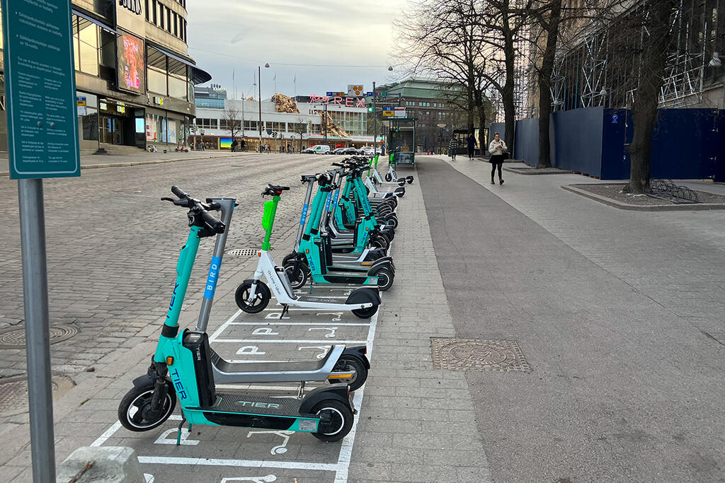 Electric scooters parked in the city centre in summer 2022.