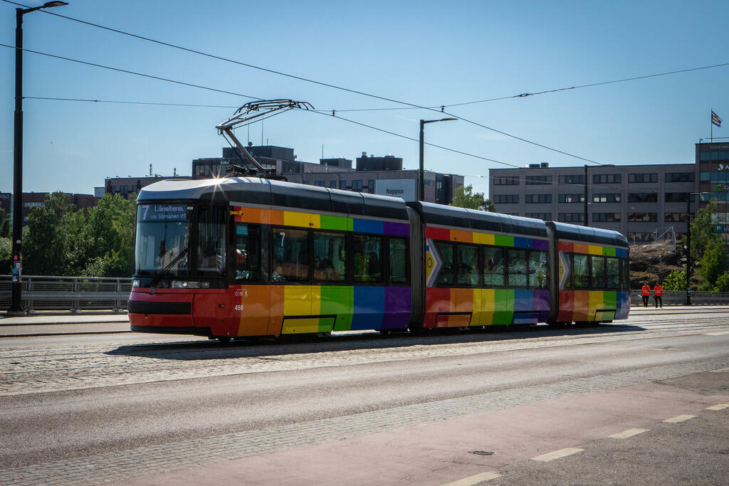 Pride tram in rainbow colors.