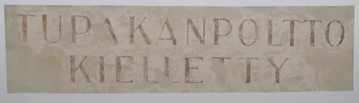 Teksti seinässä Tupakanpoltto kielletty