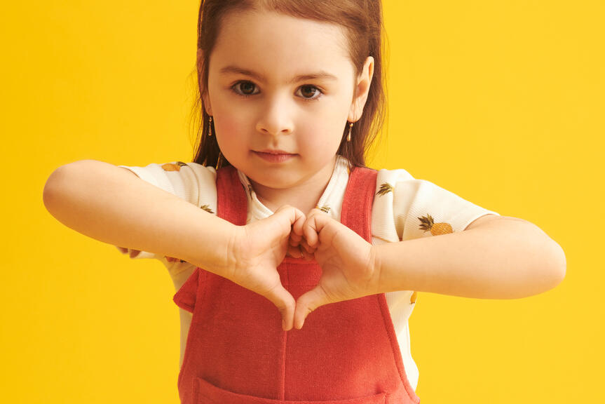 Girl in front of yellow background