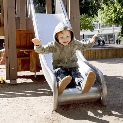 A child is going down a slide