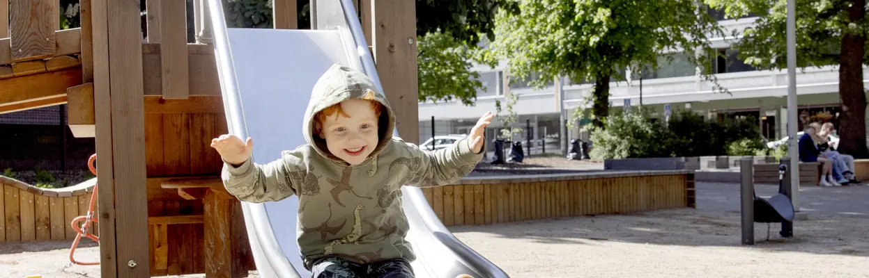 A child is going down a slide