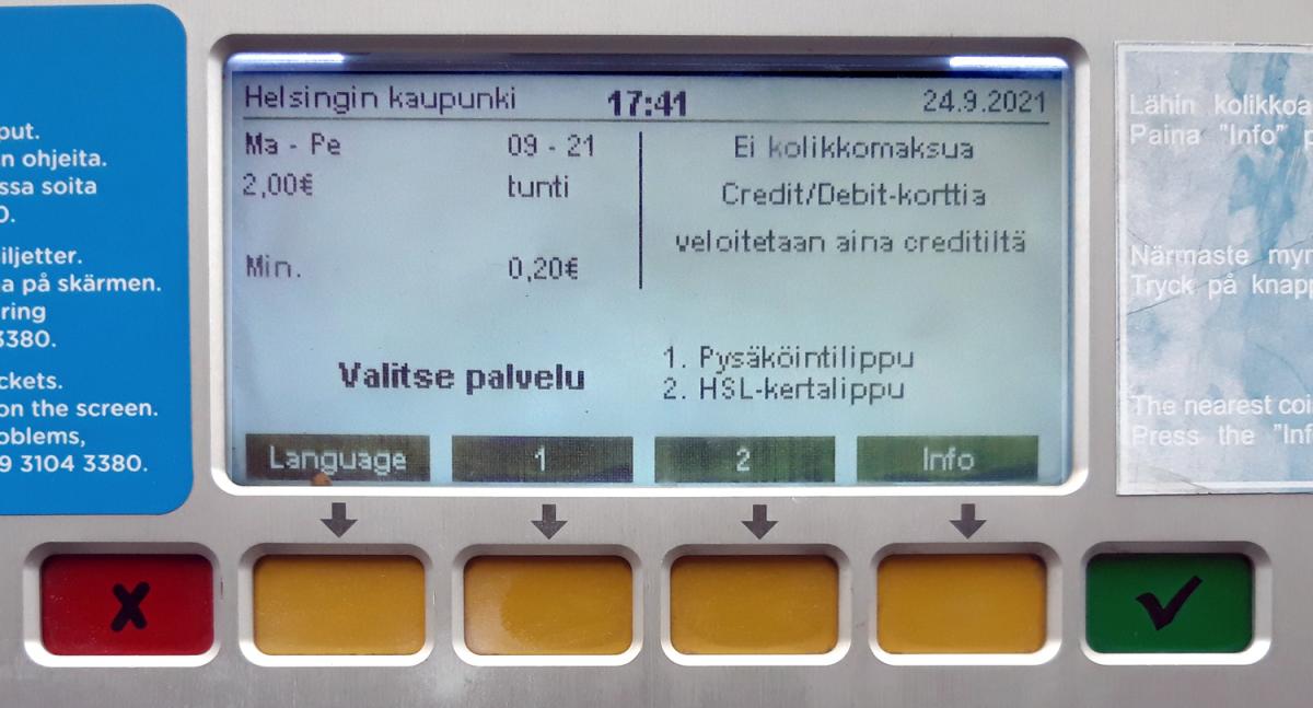 Pysäköintilippuautomaatin näytössä ohjeistetaan pysäköinnin maksaminen.