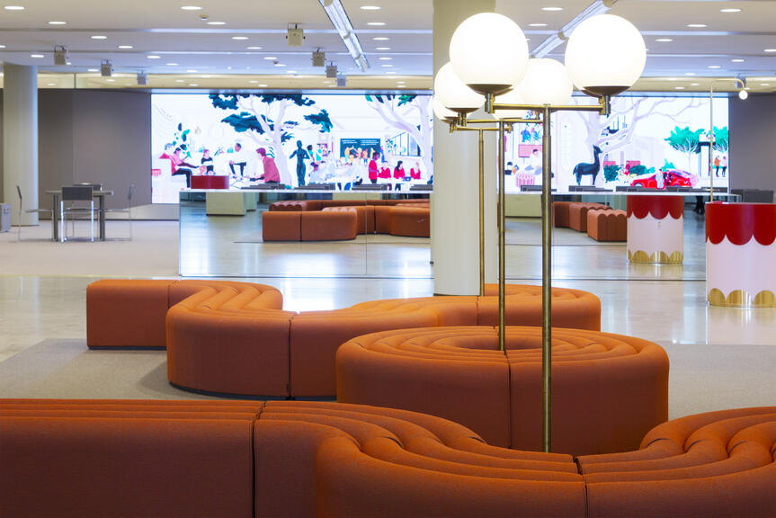 The city hall lobby with lit info screens.