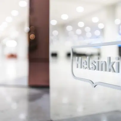 White Helsinki logo in the lobby of the cityhall.