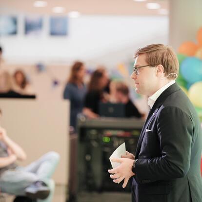 Mayor Sazonov speaking at Helsinki Welcome Day event