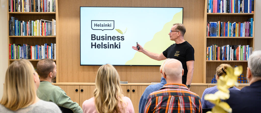 A man giving a presentation about Business Helsinki